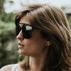 Female Model side view of the Black Breach Sunglasses and Silver Mini Unity Hoops by Brass and Nity 